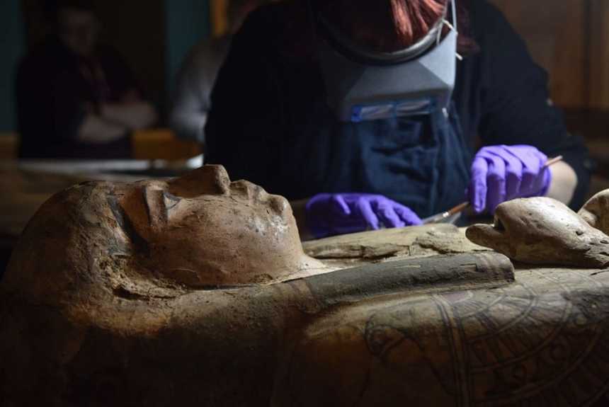 Paintings discovered inside coffin of 3,000-year-old Egyptian mummy 3 Conservators at Perth Museum and Gallery cleaning the 3,000 old mummy Ta-Kr-Hb's coffin.