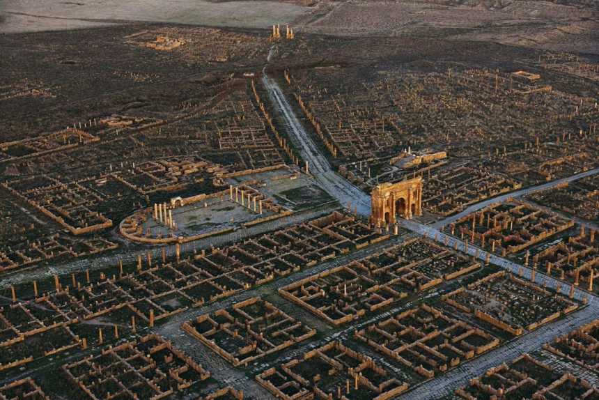 Trajan's Arch within the ruins of Timgad.